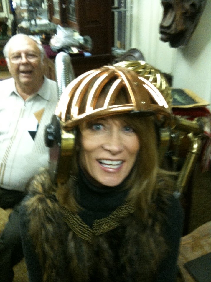 Old hair dryer from the turn of the century delights museum visitor.